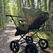 Ora Sisu sisarusrattaat sammalen värisenä metsässä