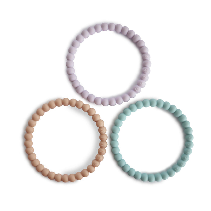 Mushie silikoninen purulelu/rannekoru (lilac/cyan/soft peach)